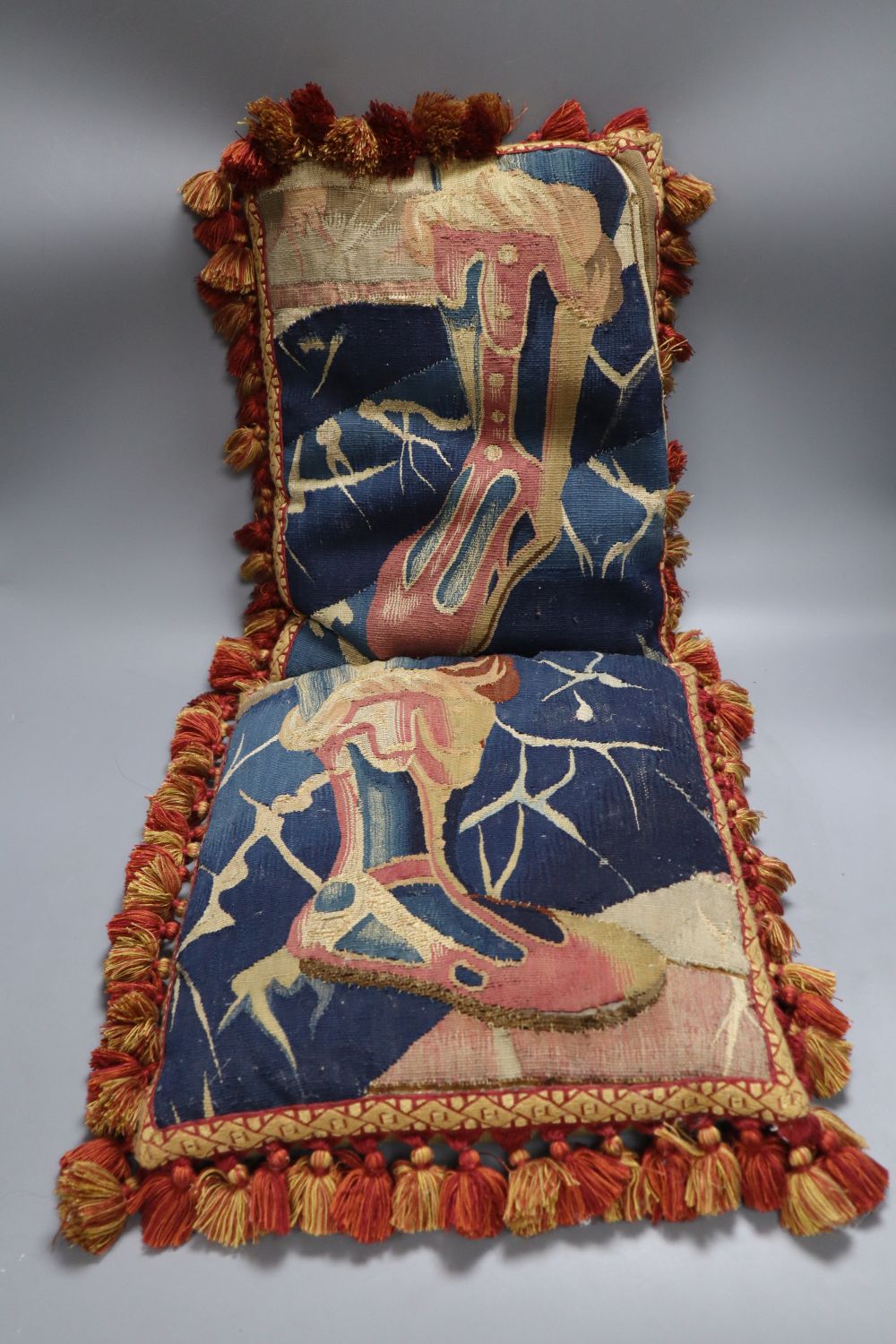 A pair of Aubusson cushions with tassel edge, 28 x 38cm
